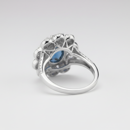 White Gold Diamond Halo Ring with Deep Blue Center Stone – IGI Certified-Saleh Sallom