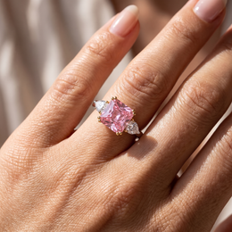Princess-Cut Pink Stone Three-Stone Ring with Pear-Cut White Side Stones in 925 Sterling Silver