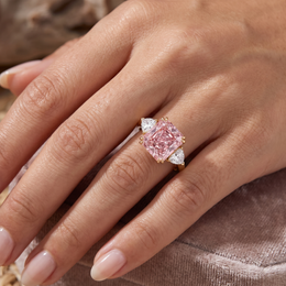 Princess-Cut Pink Stone Three-Stone Ring with Trillion-Cut White Side Stones in Gold-Tone 925 Sterling Silver