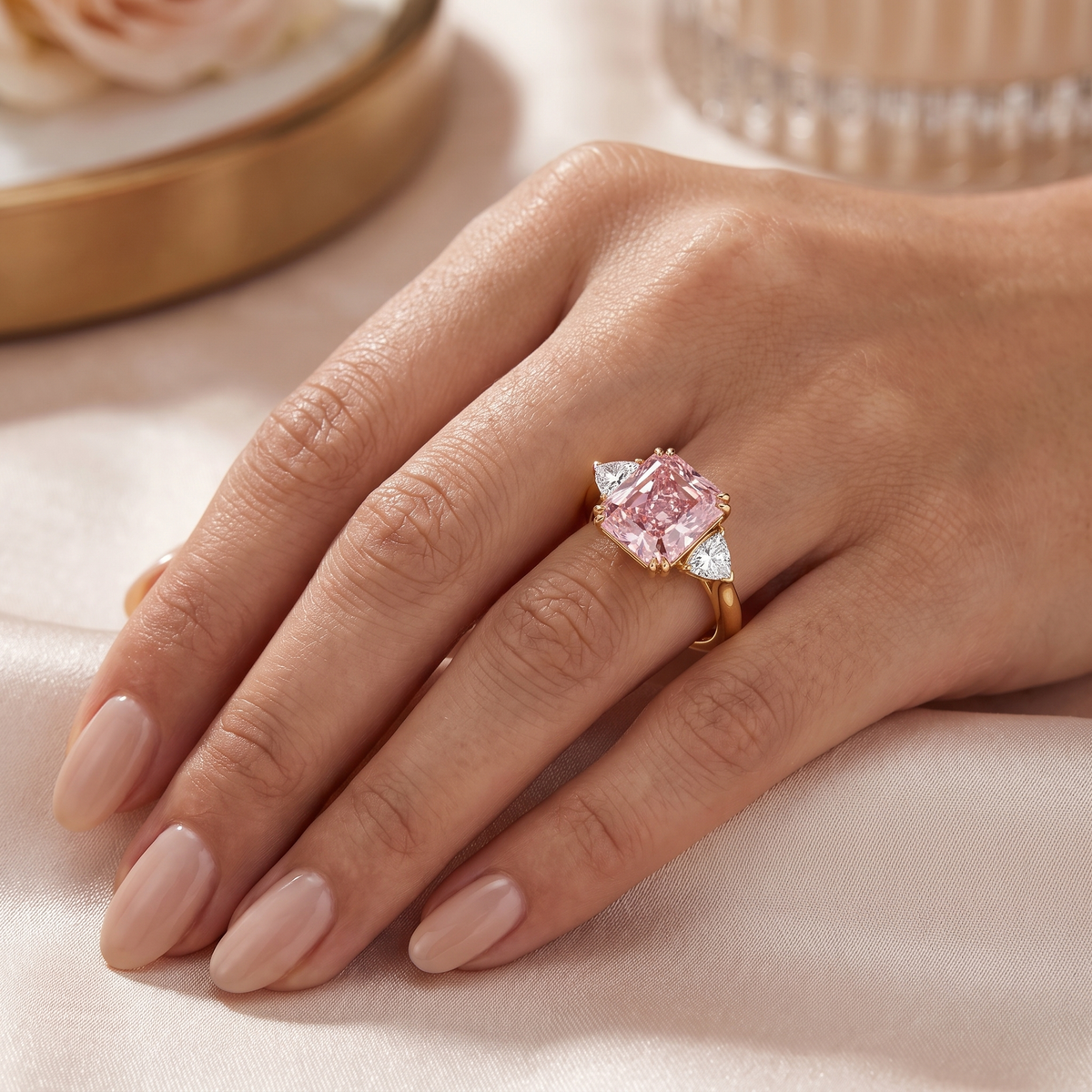 Princess-Cut Pink Stone Three-Stone Ring with Trillion-Cut White Side Stones in Gold-Tone 925 Sterling Silver