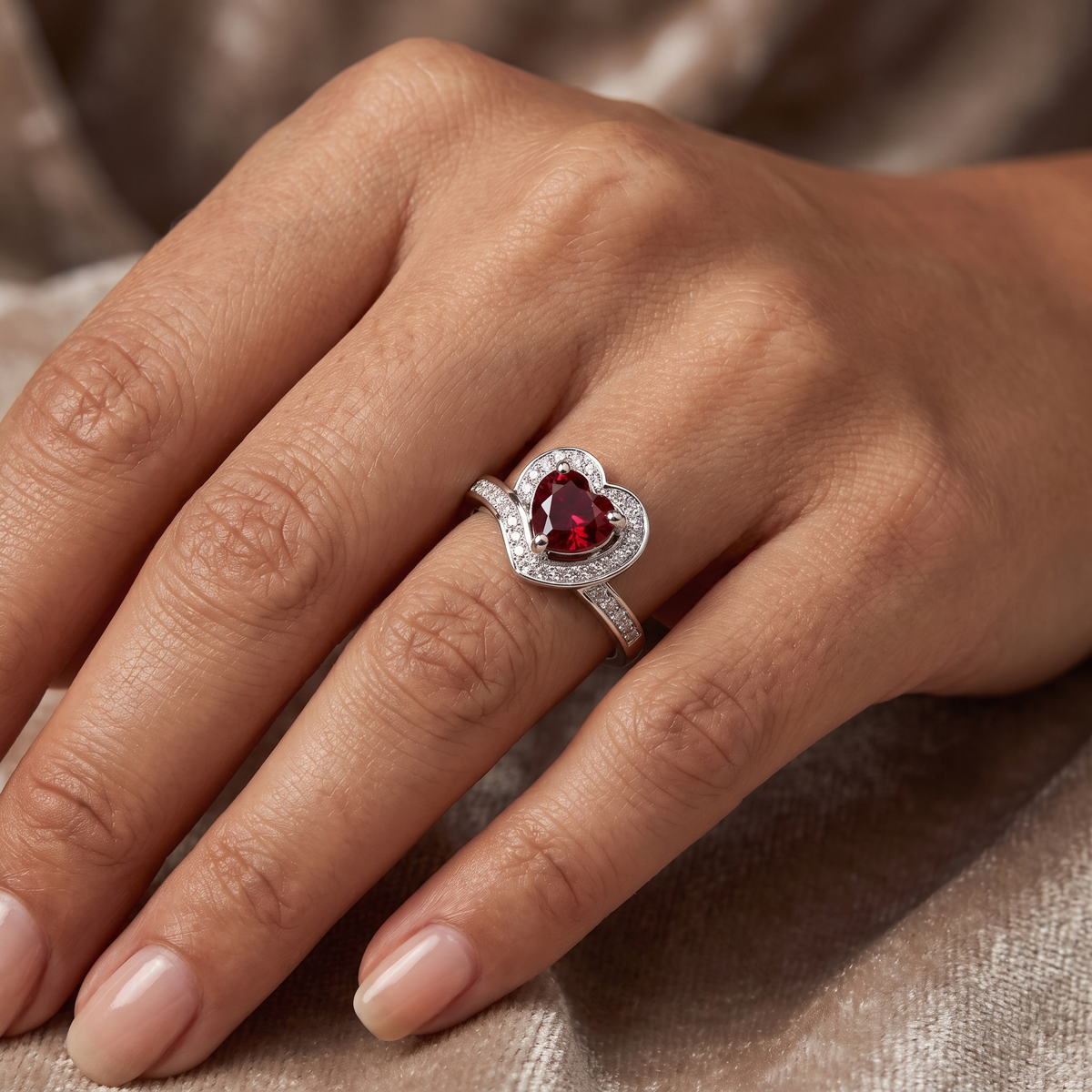 Heart-Shaped Red Stone Halo Ring with White Accent Stones in 925 Sterling Silver